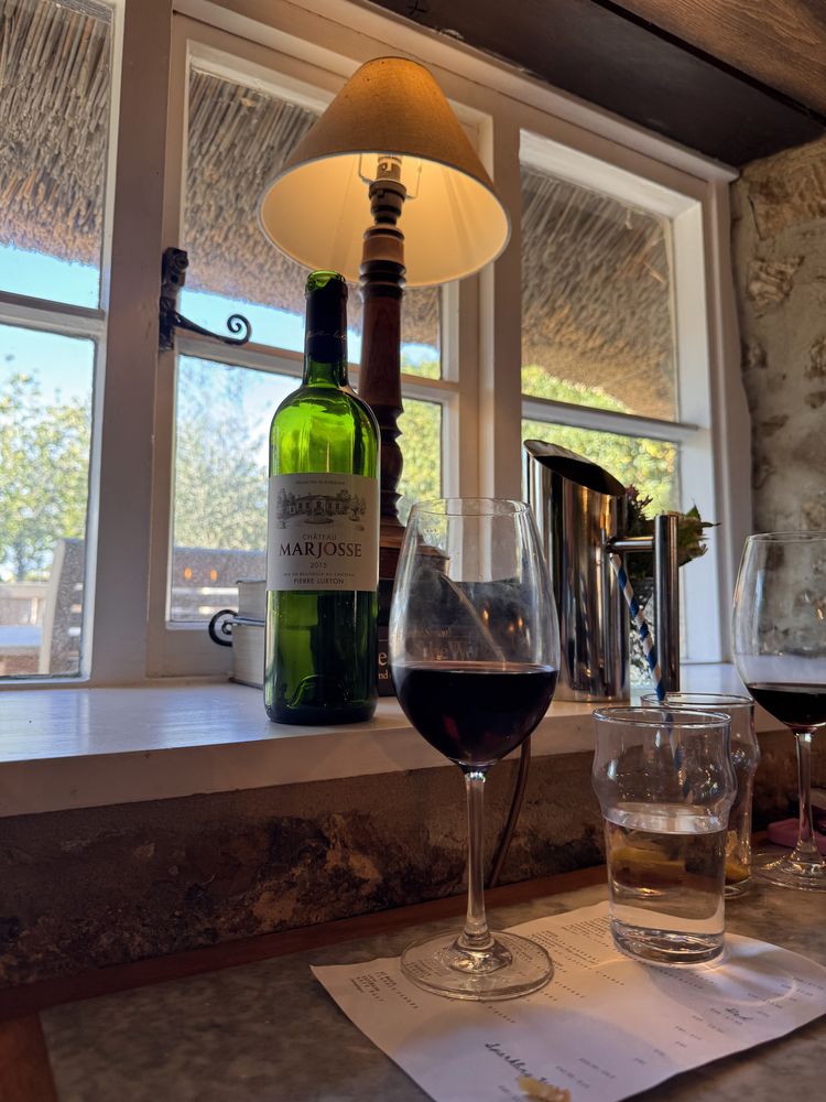 A glass and bottle of 2015 Château Marjosse on the windowsill at the Duke of Cumberland's Head